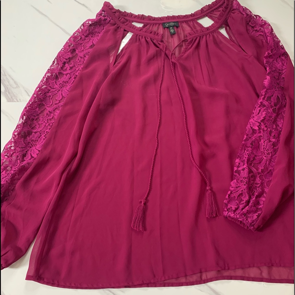 Jessica Simpson burgundy top with lace sleeves.